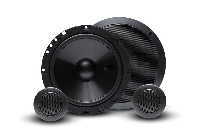 What types of material are commonly used for speaker enclosure